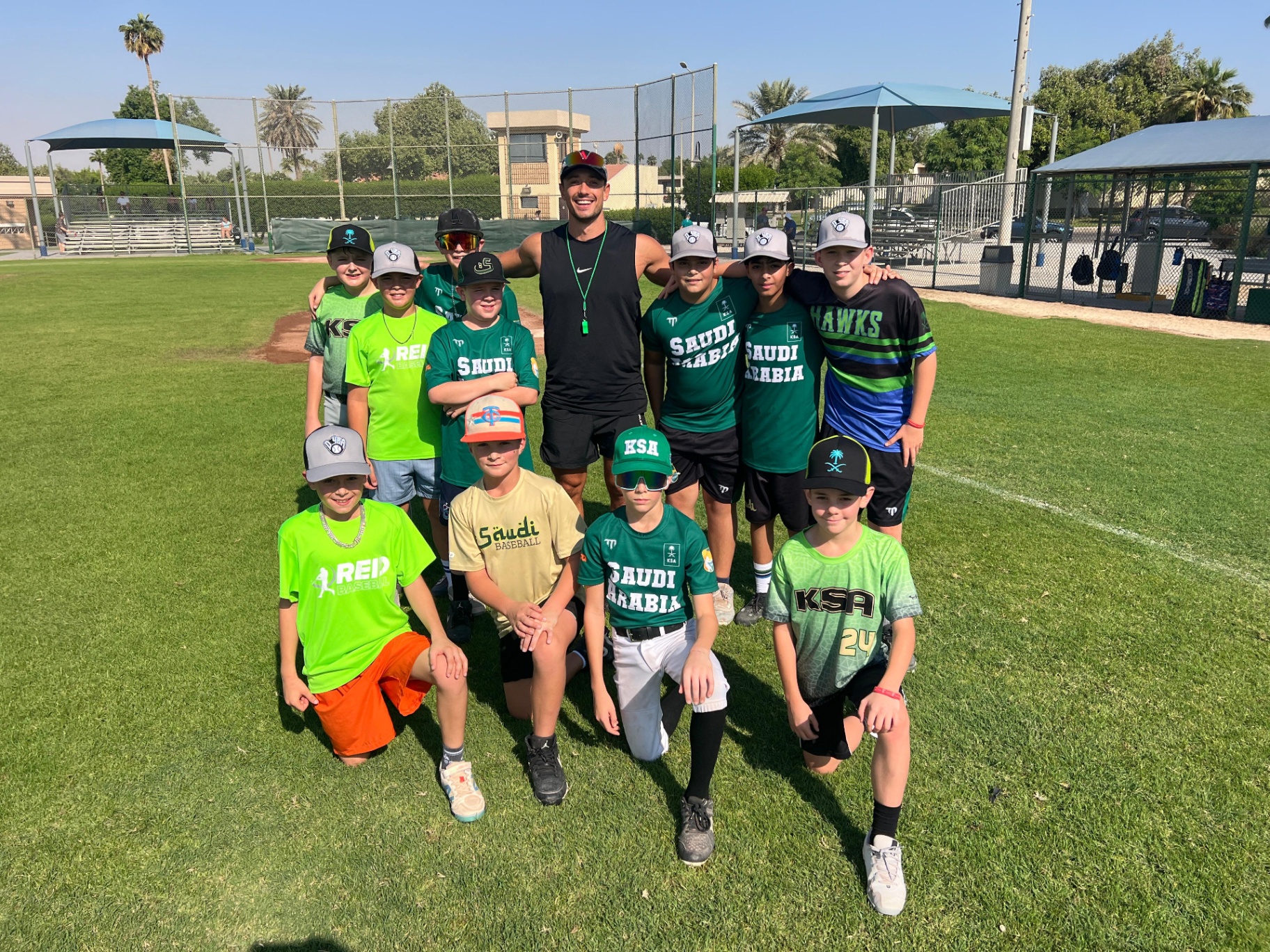 Chris with a youth baseball team in Dubai